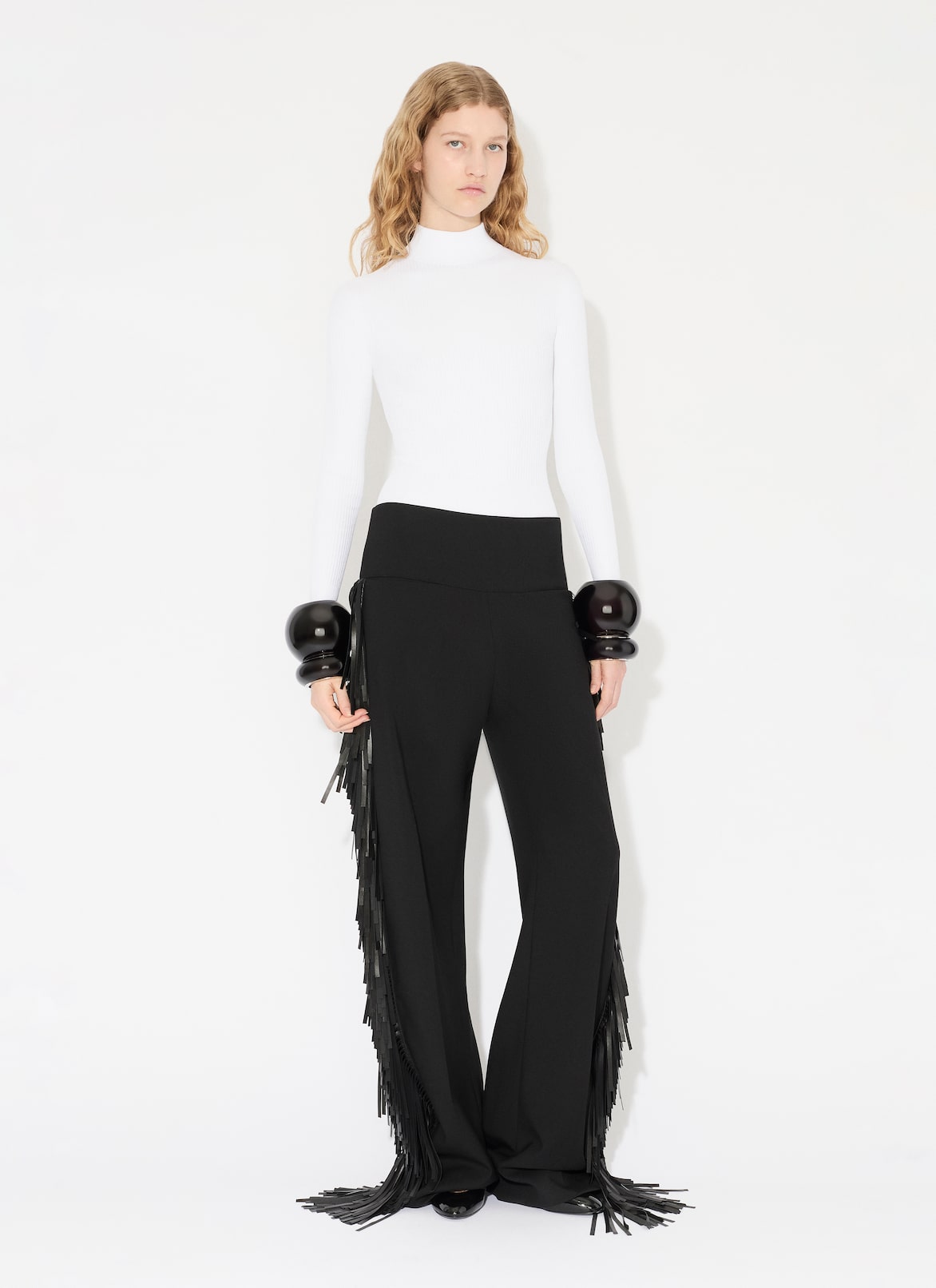 FRANSENHOSE AUS WOLLGABARDINE ALAÏA SCHWARZ FRANSENHOSE AUS WOLLGABARDINE